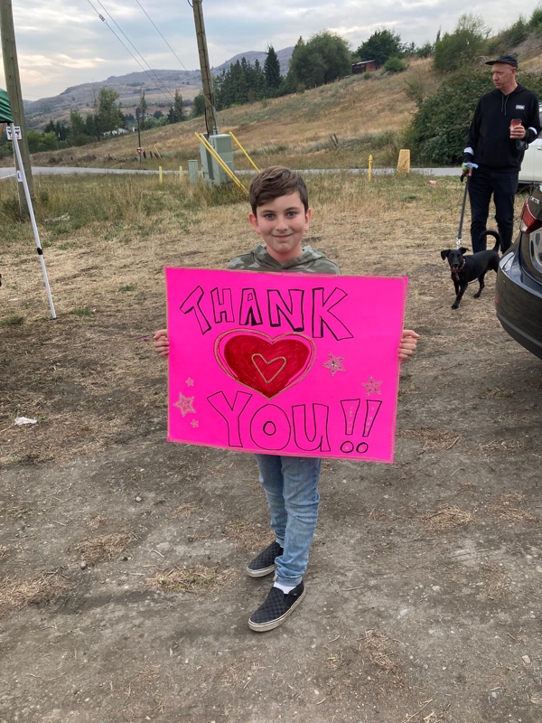 boy with thank you sign