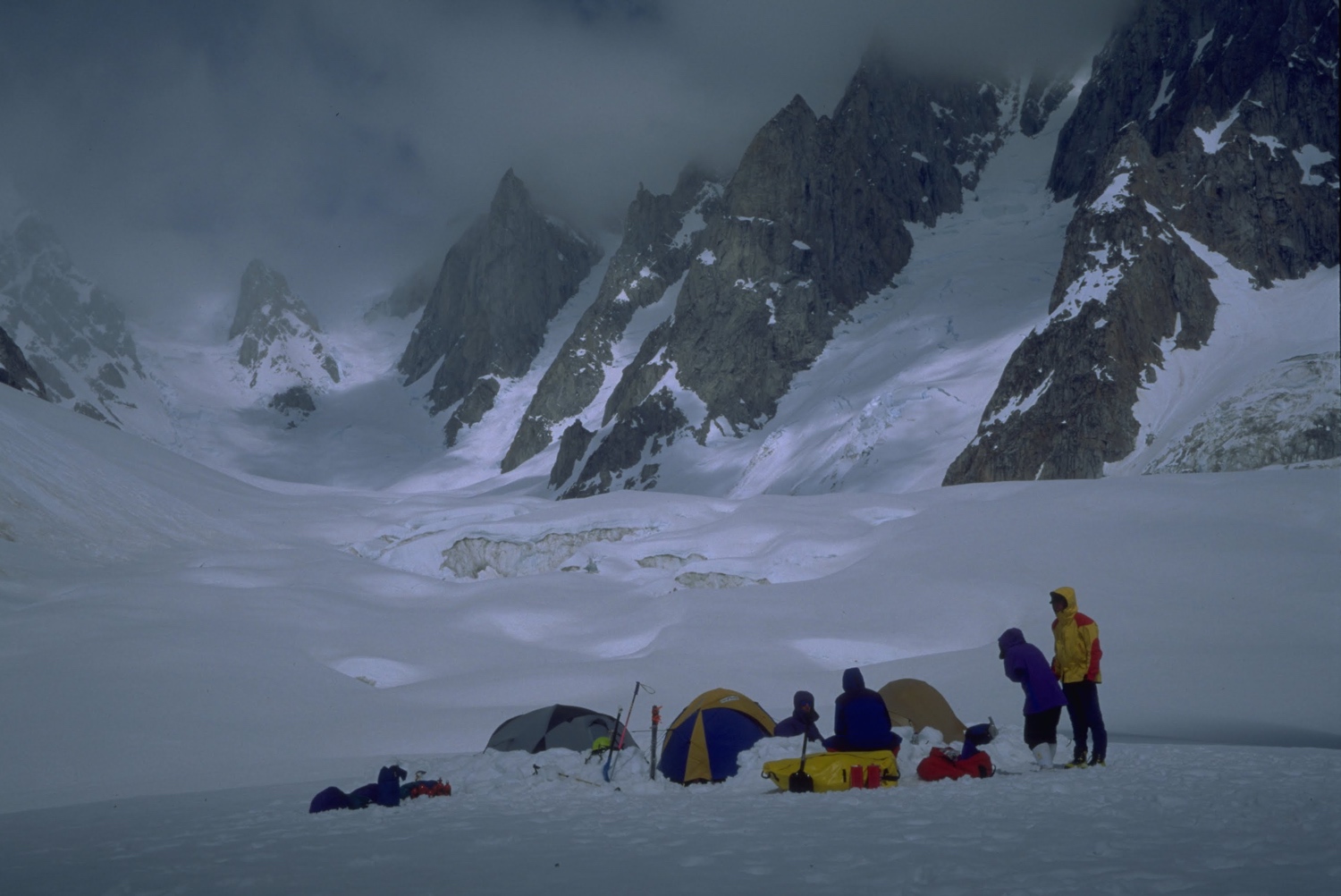 people tenting in a snowy base camp